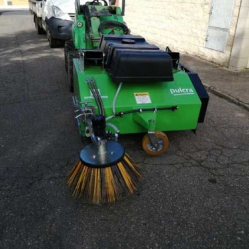Maquinaria barredora de color verde